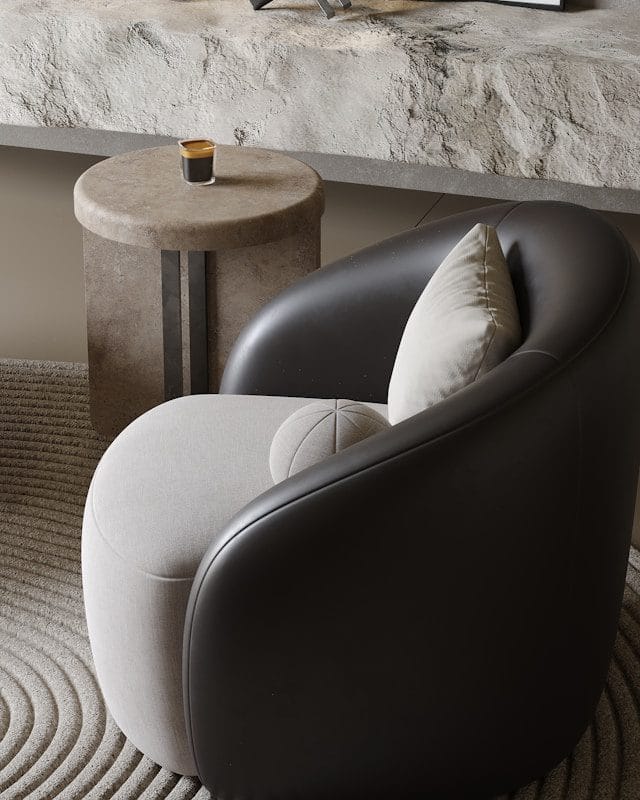 Modern armchair with accent pillow and side table